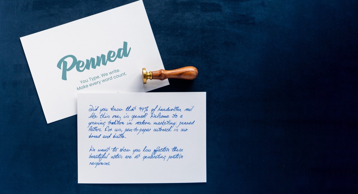A Penned branded card and a handwritten note with a wax seal on a navy background