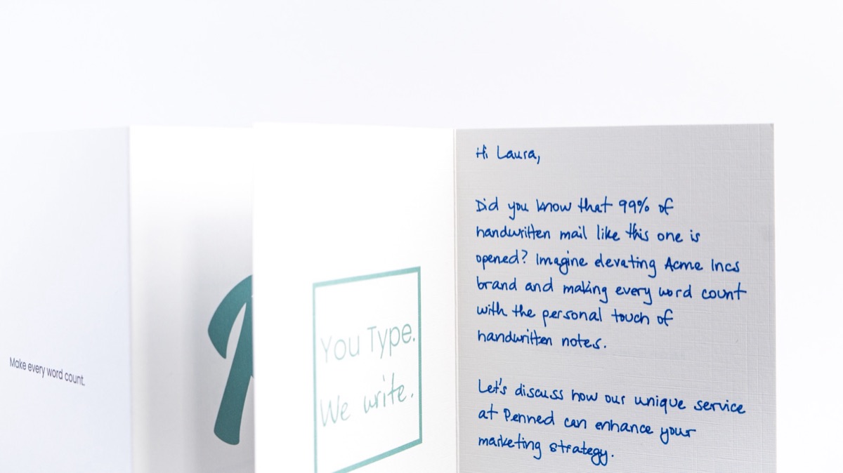 Penned branded cards and a handwritten note on premium paper